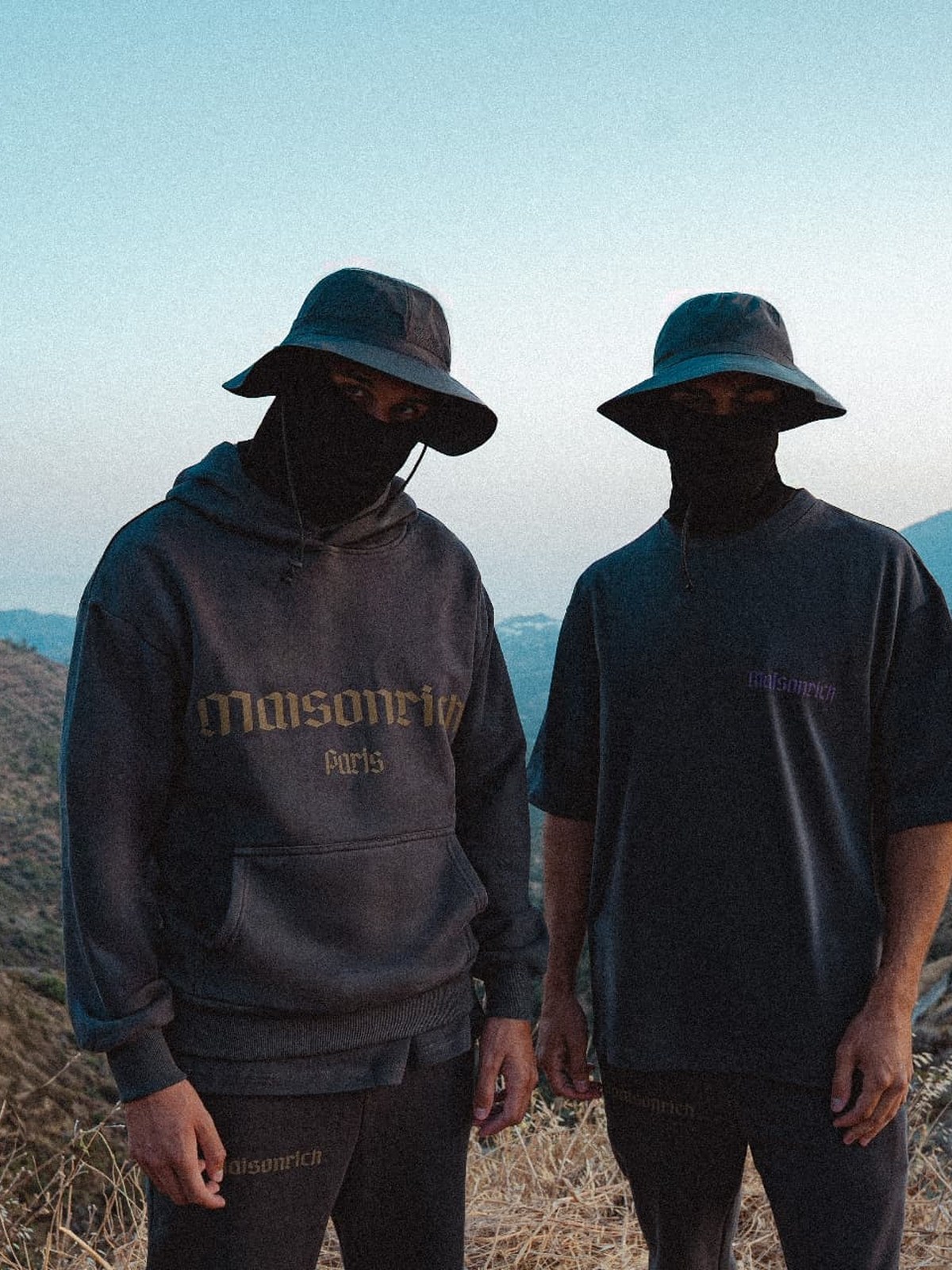 Maison Rich Paris campaign — two models in the mountains wearing the Trinité Originale collection